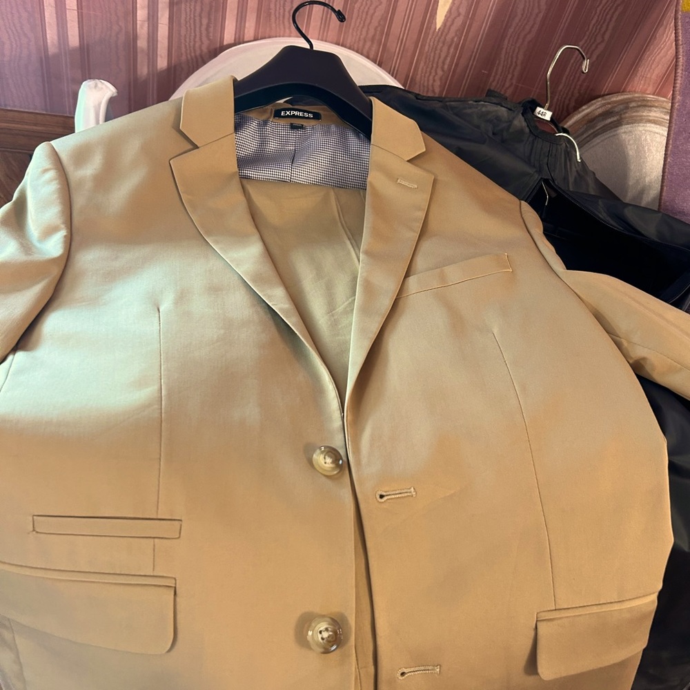 Homecoming ready to boardroom Men’s Express Khaki suit.